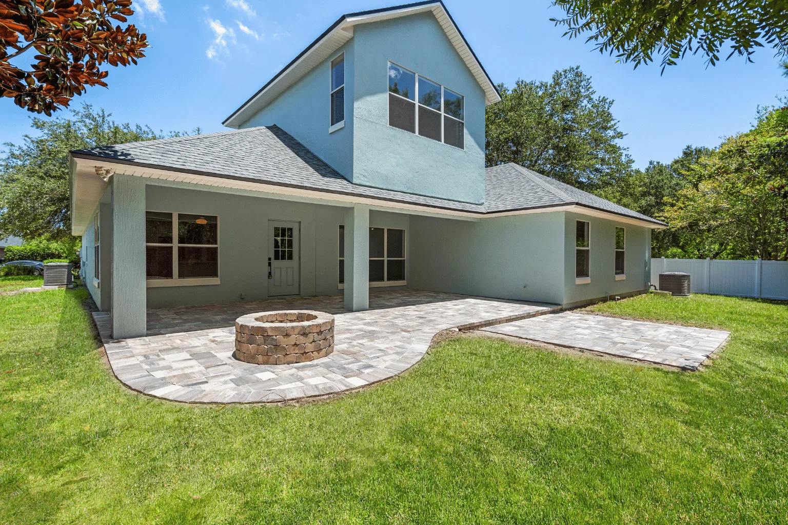 Paver patio and fire pit installation with pathway lighting by Jax Pavers in Jacksonville FL